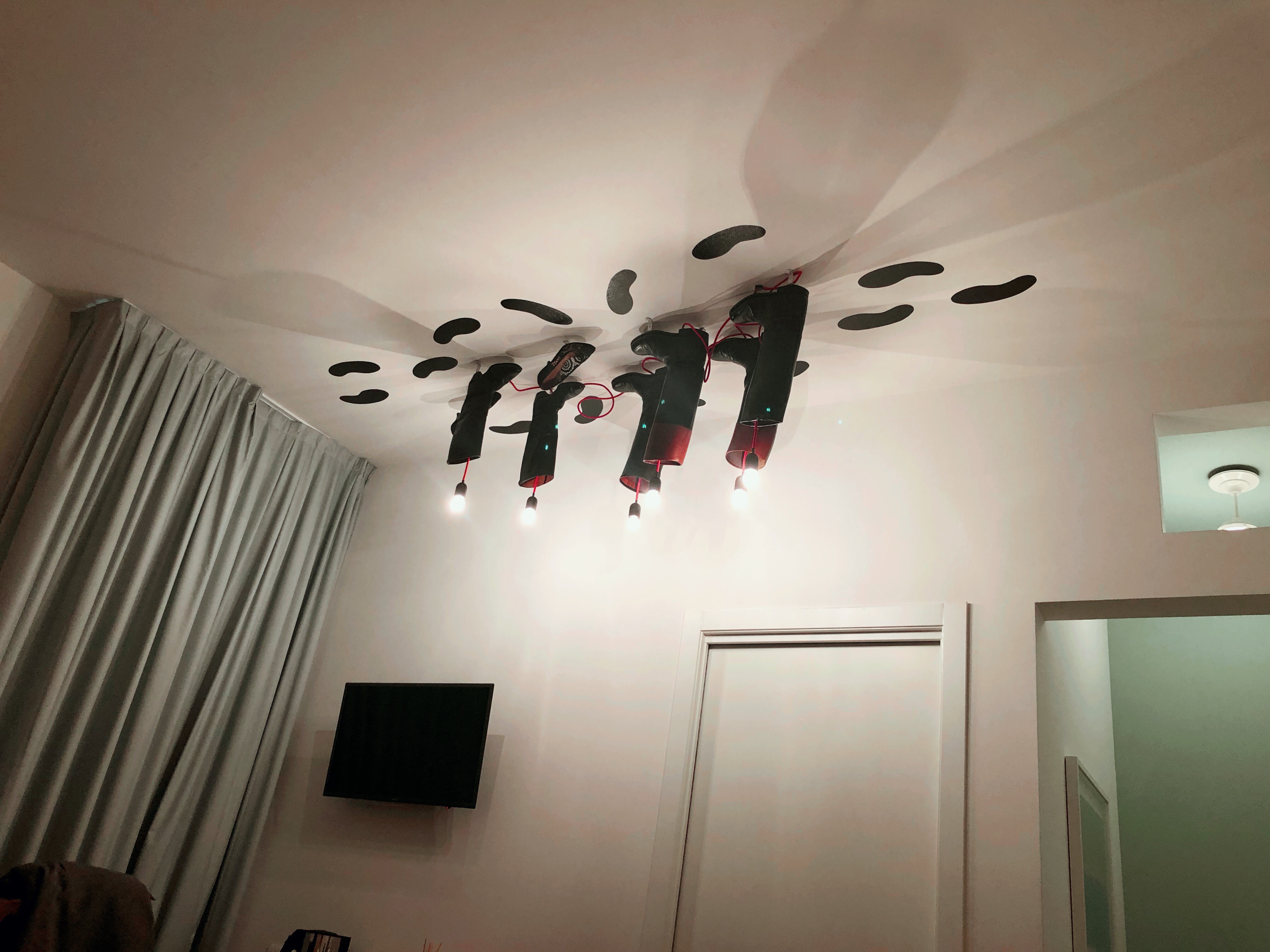 Ceiling Light Fixture of Boots at Casa Bertagni Bologna Italy 